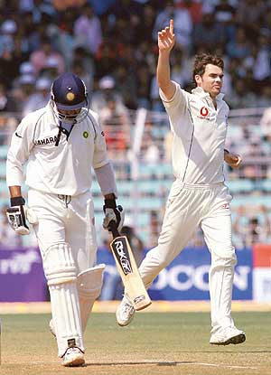 England�s James Anderson celebrates after taking the wicket of Harbhajan Singh on the third day of the third Test at the Wankhede Stadium in Mumbai on Monday.