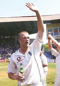 Man of the match and man of the series Andrew Flintoff, captain of England, waves during a victory lap after winning the third Test against India at the Wankhede stadium in Mumbai on Wednesday