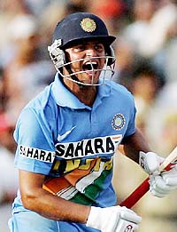 Suresh Raina celebrates India’s four-wicket victory over England in the second One Day International at Faridabad on Friday.