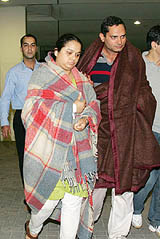 An Indian couple, who survived a boat sinking incident, walk out of a hospital in Bahrain on Friday. At least 57 persons drowned and 13 went missing after a tourist boat taking passengers on a dinner cruise capsized.