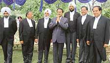 The new Judges of the Punjab and Haryana High Court with Chief Justice D.K. Jain after the oath-taking ceremony in Chandigarh on Saturday