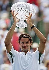 Roger Federer of Switzerland holds the trophy after defeating Ivan Ljubicic of Croatia in the Nasdaq-100 Open final at Crandon Park in Miami, Florida, on Sunday. Federer won 7-6, 7-6, 7-6. 