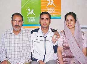 Sanjeev Rajput with his parents in Jagadhri on Tuesday