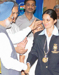 Avneet Kaur shakes hands with Prime Minister Manmohan Singh at a function held at his residence in New Delhi on Wednesday