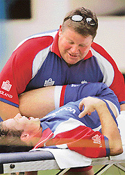 England cricketer Geraint Jones is given a massage by physiotherapist Dean Conway during a practice session at The Jawaharlal Nehru Stadium in Kochi on Wednesday