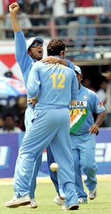 India’s captain Rahul Dravid celebrates with Yuvraj Singh after the dismissal of England’s captain Andrew Flintoff during their fourth one-day international cricket match in Kochi on Thursday