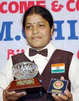 Chitra Magimairaj, who won the World Ladies Billiards Championship at Cambridge recently, poses with her trophies during a felicitation function organised by Karnataka Billiards Association in Bangalore on Saturday. 