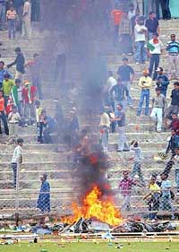 Spectators burn hoardings after the fifth one-dayer between India and England was called off in Guwahati on Sunday