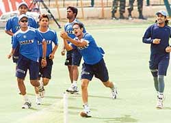 Irfan Pathan is watched by team-mates as he catches a ball during a practice session at the Keenan Stadium in Jamshedpur on Tuesday. 