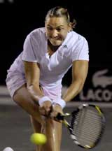 Nadia Petrova of Russia hits a return to Alona Bondarenko of Ukraine during their third-round match at the Family Circle Cup tournament in Charleston, South Carolina
