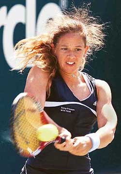 Patty Schnyder of Switzerland returns a backhand during her 2-6, 6-3, 6-2 upset victory over Justine Henin-Hardenne of Belgium during the semifinals of the Family Circle Cup in Charleston