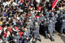 Nepalese riot policemen push back pro-democracy activists during demonstrations in Chabahil district of Kathmandu on Thursday