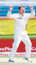 Australian bowler Stuart MacGill celebrates dismissing Bangladeshi batsman Aftab Ahmed on the last day of the second Test