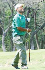 Vinod Kumar watches his tee shot on the 15th hole during the Hero Golf Chandigarh Open at the Chandigarh Golf Club on Thursday