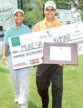 Mukesh Kumar (right) with his caddie after winning the Hero Golf Chandigarh Open on Friday.