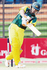 Adam Gilchrist of Australia hits a boundary off Bangladeshi bowler Sayed Rasel during the first one-day in Chittagong on Sunday.
