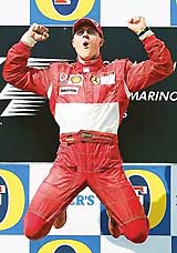 Ferrari Formula One driver Michael Schumacher of Germany celebrates after winning the San Marino Grand Prix in Imola, Italy, on Sunday