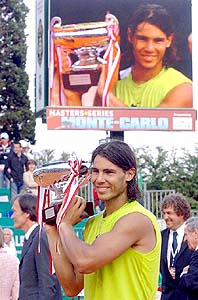Rafael Nadal of Spain holds the winner�s trophy after defeating Roger Federer of Switzerland at the Monte Carlo Open final in Monaco on Sunday