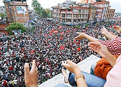 Nepalese pro-democracy activists celebrate after Nepal’s King Gyanendra announced the end of 14 months of absolute rule and restored Parliament which was dissolved in 2002, in Kathmandu, on Tuesday.