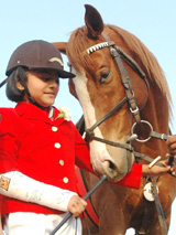Aafreen Chaudhary, with her right arm in a plaster cast, with her horse after winning a silver in the junior hacks at the Chandigarh Horse Show in Chandigarh on Wednesday