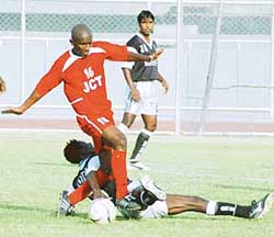 JCT striker Marcos Pereira tries to get past Gley Yao Rodrigue of Mohammedan Sporting in a National Football League match at Ludhiana�s Guru Nanak Stadium on Thursday