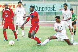 Sporting Clube de Goa�s Felip Gomes makes a vain bid to stop JCT�s Johnson Banner as Marcos Pereira looks on