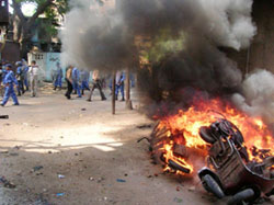 A vehicle seen burning after fresh violence broke out in the old city of Vadodara on Wednesday.