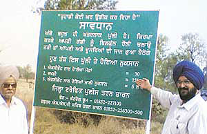 A caution board on a bridge on the Tarn Taran-Amritsar road.