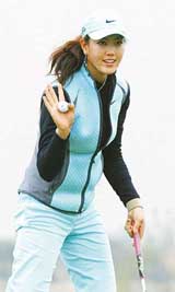 American golfer Michelle Wie waves to fans on the second day of SK Telecom Open at the Sky 72 Golf Club in Inchon