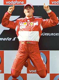 German Ferrari driver Michael Schumacher jumps in celebration after winning the Grand Prix of Europe at the Nurburgring racetrack in Nurburg, Germany