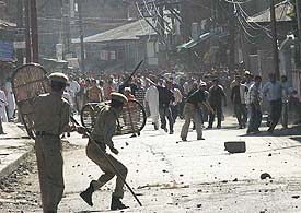 Jawans and protesters throw stones at each other during a bandh call by the bar association and Dukhtareen Millat in Srinagar on Friday.