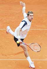 Max Mirnyi of Russia returns to Germany�s Nicolas Kiefer at the Hamburg Masters in Hamburg on Wednesday