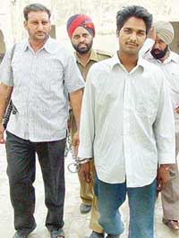 Pakistani spy Mohammad Nasar in police custody prior to his being produced in a Bathinda court on Friday. 