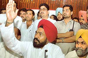 Punjab Congress president Shamsher Singh Dullo talks to reporters in Jalandhar on Sunday. 