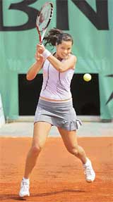 Ana Ivanovic of Serbia & Montenegro plays a shot to France�s Emilie Loit during the second round of the French Open in Paris on Thursday