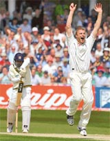 England�s Andrew Flintoff celebrates after taking the wicket of Sri Lanka�s Mahela Jayawardene during the first day of their third Test in Trent Bridge