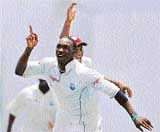 Dwayne Bravo of the West Indies celebrates after dismissing V.V.S Laxman during the first Test in St. John�s on Friday