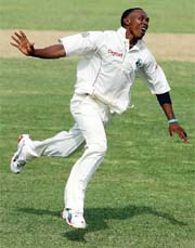 West Indies� Dwayne Bravo celebrates after taking the wicket of Mohammad Kaif on the first day of the first Test in St. John�s