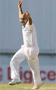 Virender Sehwag celebrates after taking the wicket of West Indian batsman Shivnarine Chanderpaul on the second day of the first Test in St John�s, Antigua