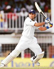 Mahendra Dhoni hits a shot on the fourth day of the first Test against the West Indies in St. John�s