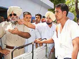 Mr Balwant Singh Dhillon and his son having an argument with the Kotwali SHO after a brawl in Bathinda on Saturday.