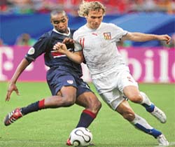 Czech midfielder Pavel Nedved vies with US defender Eddie Pope during a Group E match in Gelsenkirchen
