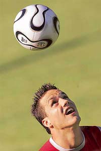 Swiss defender Philipp Degen plays with the ball on Sunday prior to a training session at the Uessbachtal Stadium