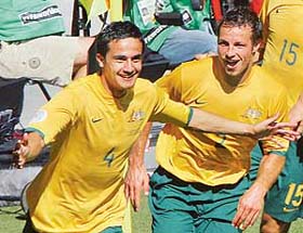 Australia�s Tim Cahill celebrates with a team-mate after scoring his second goal against Japan in their Group F World Cup football match in Kaiserslautern