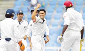 Anil Kumble celebrates with team-mates after dismissing West Indian batsman Chris Gayle on the third day of the second Test in Gros Islet, St Lucia
