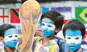 Indian boys express their support for the Argentinian team in Siliguri on Thursday