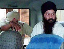 Kulbir Singh Bira being taken in a police jeep near Jalandhar on Tuesday.