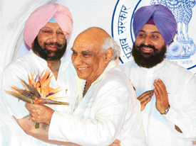 Punjab Chief Minister Amarinder Singh greets Bollywood director Yash Chopra, who was conferred with the Punjab Rattan Award at a prominent hotel in Chandigarh on Tuesday.