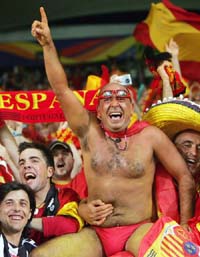 Spanish fans celebrate their team�s victory in a Group H match between Spain and Tunisia in Stuttgart on Monday. Spain won 3-1. 