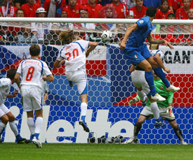 Italian defender Marco Materazzi heads the ball to score a goal during the Group E match against the Czech Republic in Hamburg on Thursday